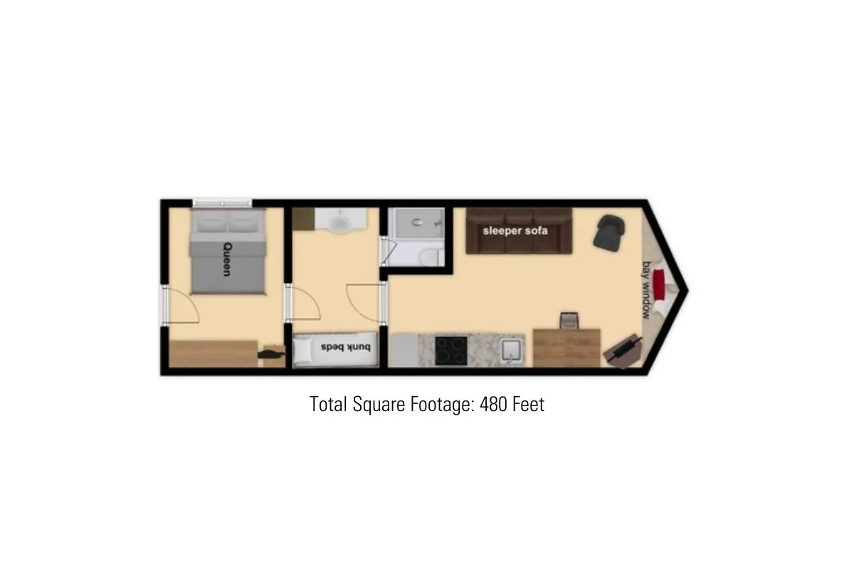 A wide-angle view showing the queen bed, bunk beds, a sleeper sofa, and part of the kitchen area in an open-concept layout. The scene feels practical and welcoming, highlighting how the different sleep zones and common areas are thoughtfully arranged.